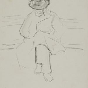 Mężczyzna w kapeluszu siedzący na ławce